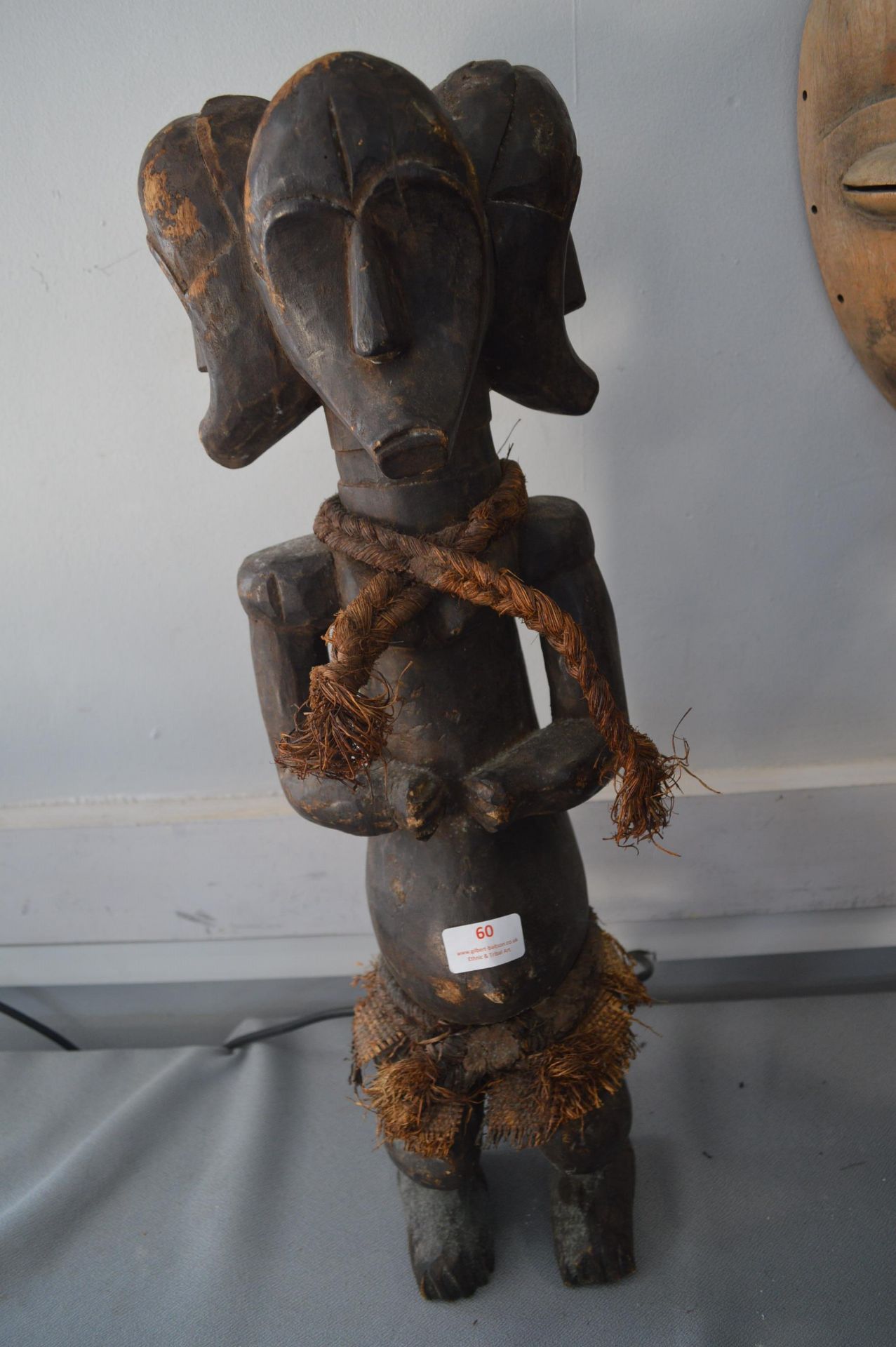 Carved Wooden Three Headed Tribal Figure with Rope Decoration