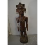 Senufo Carved Wooden Tribal Figure with Beaded and Metal Decoration