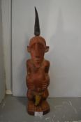 African Carved & Painted Wooden Fertility Figure with Horn and Fur Adornments