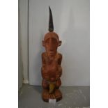 African Carved & Painted Wooden Fertility Figure with Horn and Fur Adornments