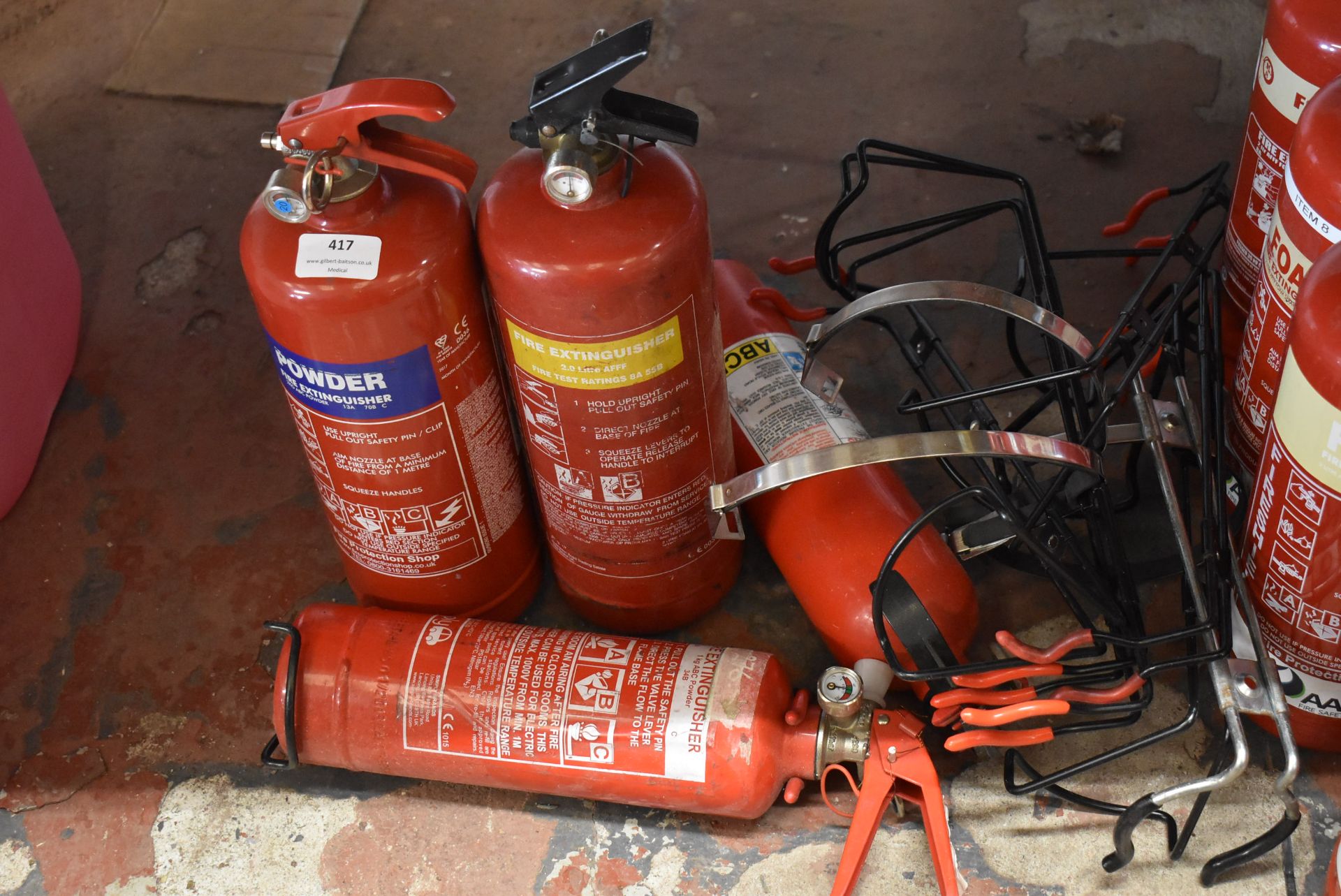 *Four Assorted Fire Extinguishers and Brackets