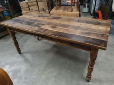 * large, heavy wooden table. Rustic top. 1800w x 850d x 770h