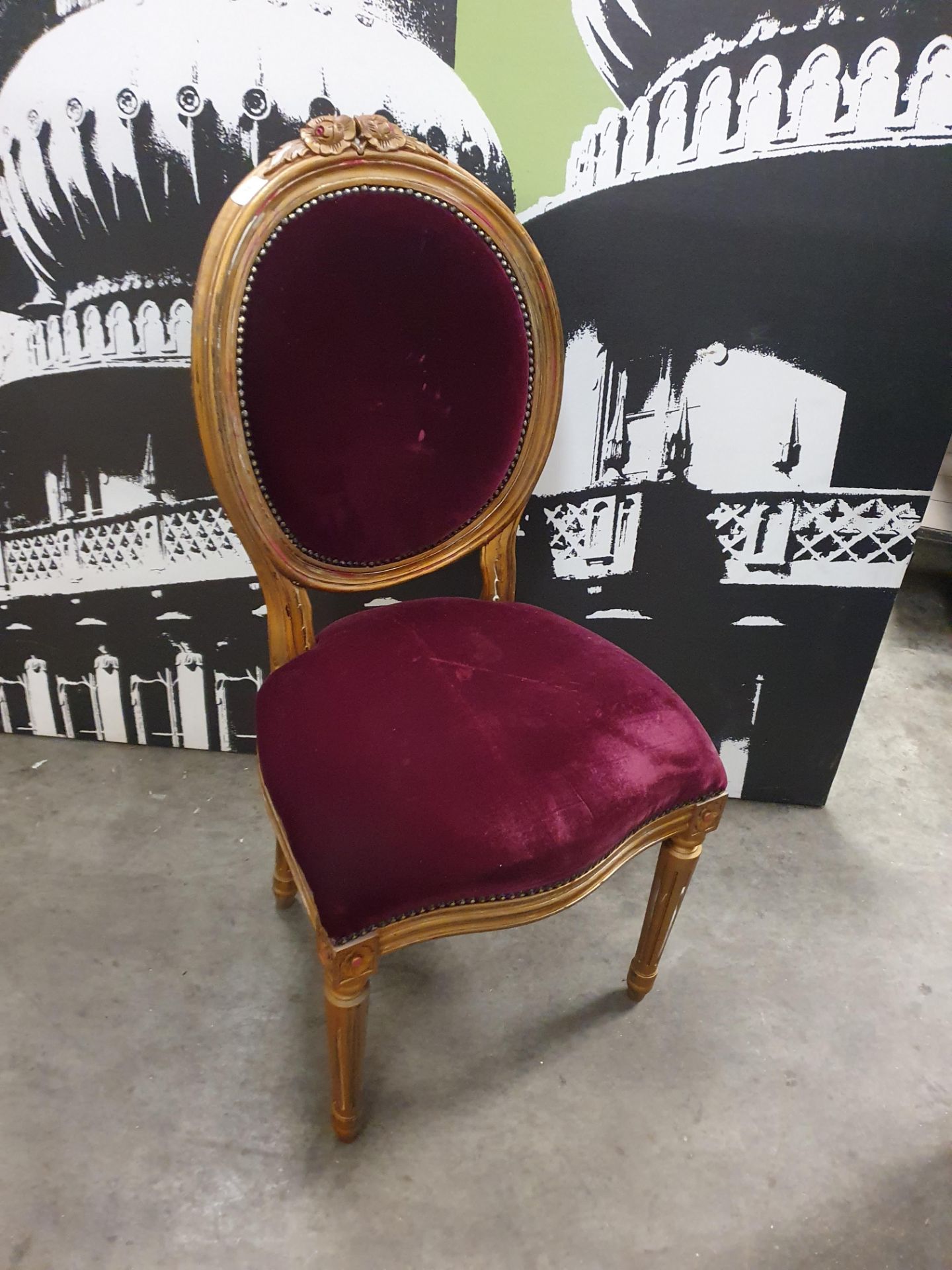 * ornate chair with red velvet seat