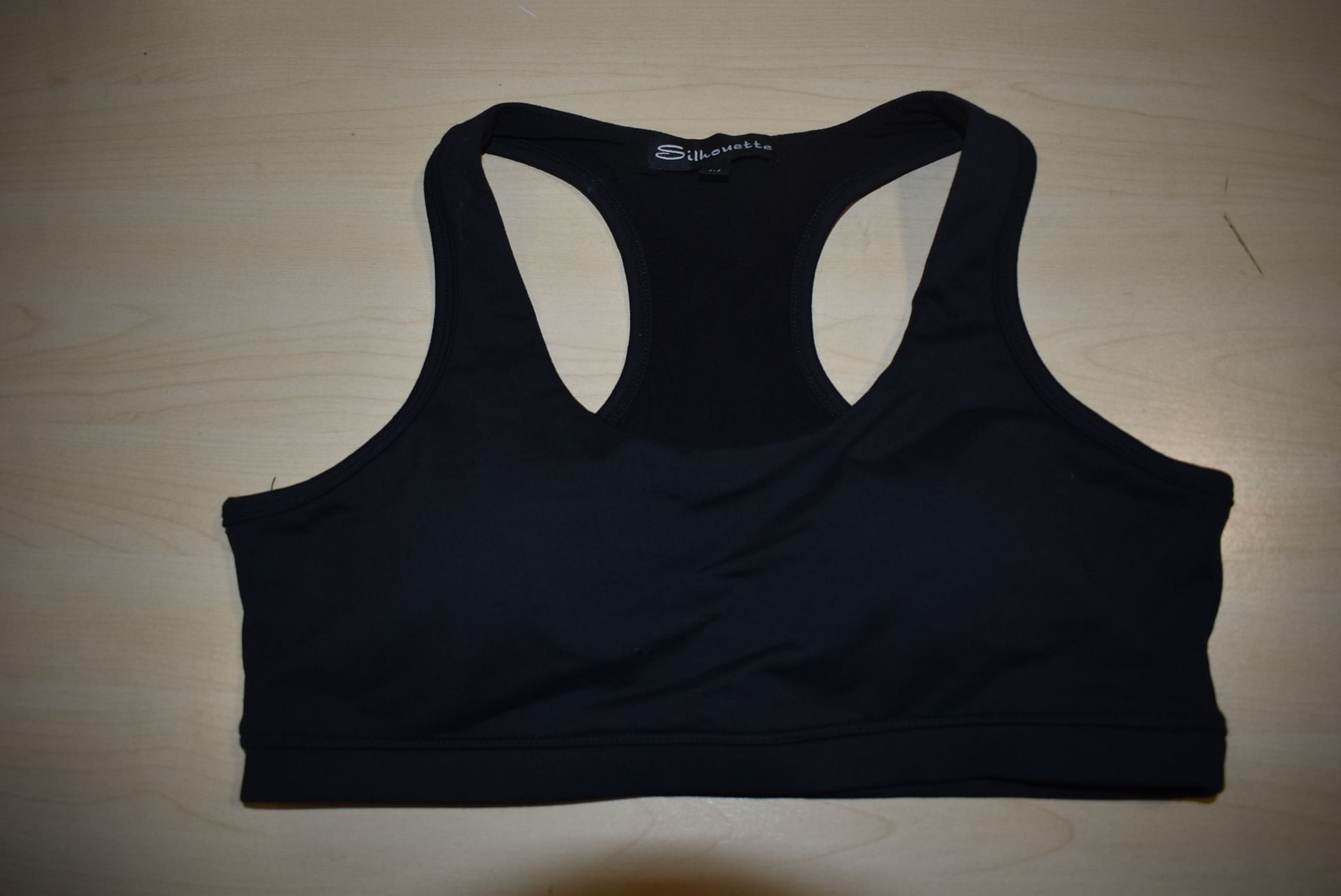 *Four Silhouette Sports Bras Size: L