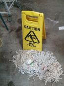 * warning sign and mop heads