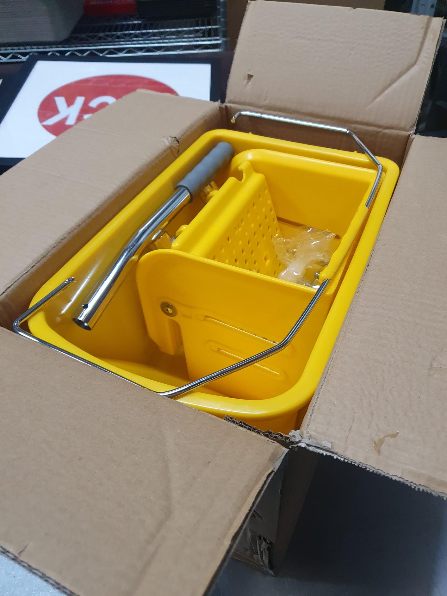 * boxed yellow mop bucket