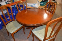 *Extending Circular Dining Table and Four Upholstered Chairs with Upholstered Seats