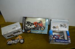 Four Boxed Motorcycle Models