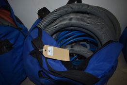 *Vented Bag Containing Various Vacuum Tubing and Floor Cleaning Attachments