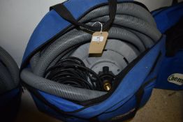 *Vented Bag Containing Vacuum Tubing, Floor Cleaner Attachments, and Electrical Extensions