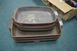 Seven Cast Iron Cooking Trays