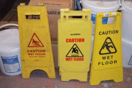 Three Wet Floor Signs