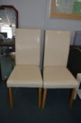 Two Cream Vinyl Highback Side Chairs
