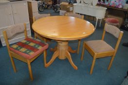 Circular Extending Dining Table with Four Matching