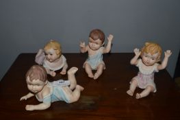 Four Contemporary Porcelain Babies