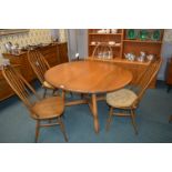 Ercol Oval Extending Dining Table with Four Ercol Chairs