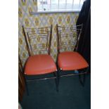 Pair of Chrome Framed Stools with Orange Vinyl Seats