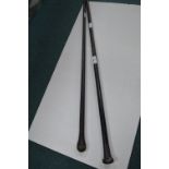 Two Ebonised Walking Canes (one with silver top)