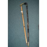 Walking Stick with Brass Handle, and a Bone Walking Stick with Carved Head