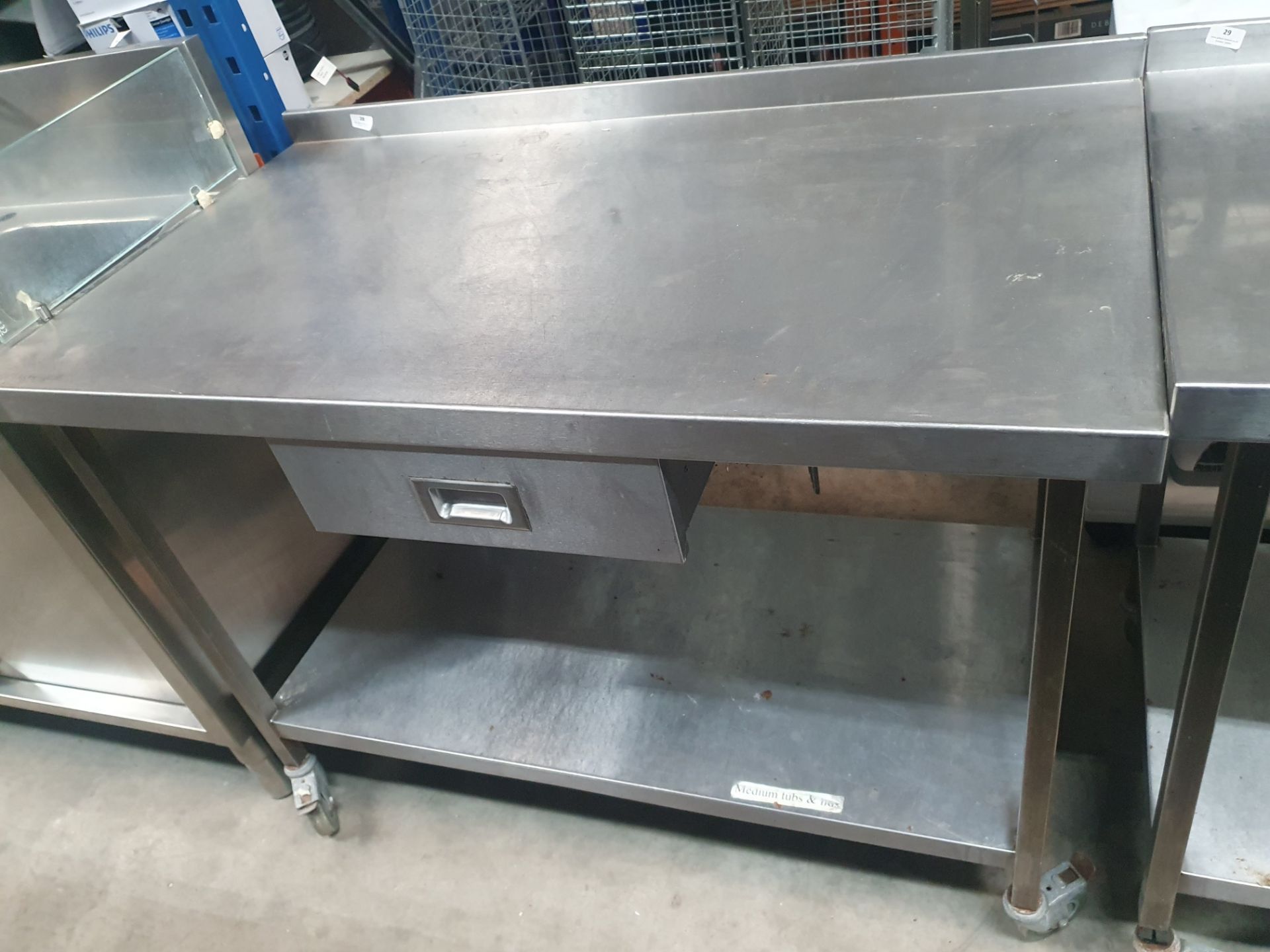 * S/S prep bench on castors with drawer and undershelf. 1250w x 700d x 940h