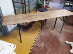 * Vintage wooden topped table with folding metal legs. 2200w x 500dd x 780h