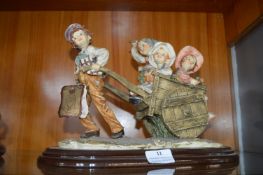 Capodimonte Figurine of Children in a Barrow