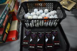 Five Packs of New Spalding Golf Balls plus a Baske