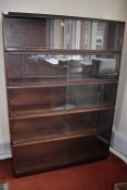 *Simplex Sectional Bookcase in Dark Mahogany Finish Enclosed by Sliding Glass Doors