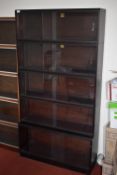 *Simplex Sectional Bookcase in Dark Mahogany Finish Enclosed by Sliding Glass Doors