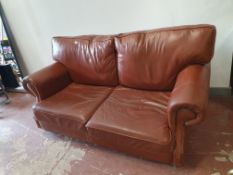 * Brown leather sofa