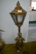 Brass Table Lamp in the form of a Boy under a Stre