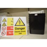 *Three Danger Signs, Two Bins, and a Quantity of Paper