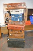 *Eight Vintage Suitcases