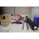 *Strapping Set Including Two Strappers, Roll of Wrap, Metal Clips, and a Strapping Sealer