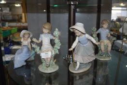 Four Nao Figurines of Children Playing