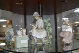 Four Nao Figurines of Children with Animals