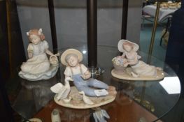 Three Nadal Figures of Seated Children