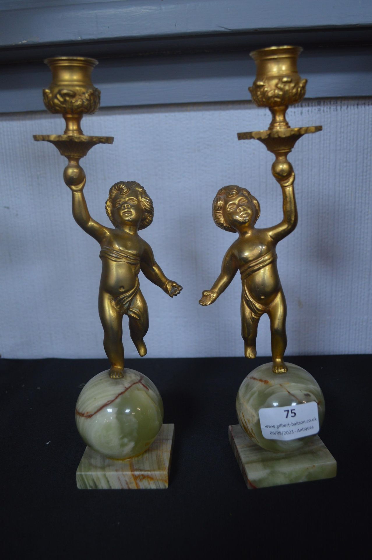 Pair of Gilded Cherub Candlesticks on Onyx Bases