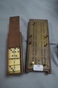 Brass Cribbage Board and a Set of Dominoes