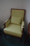 Green Upholstered Armchair with Wooden Frame