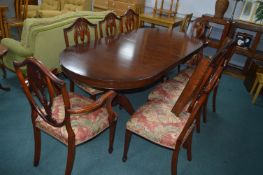 Oval Extending Dining Table with eight Shieldback