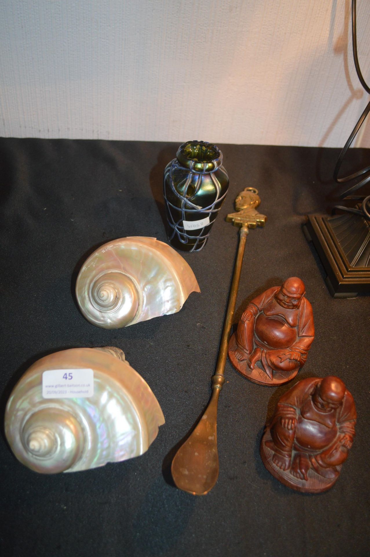 Two Shells, Two Buddhas, a Vases, and a Shoe Horn