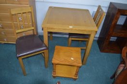 Square Dining Table with Two Chair and a Small Cof