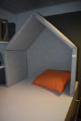 *Grey Upholstered Partitions and an Orange Cushion