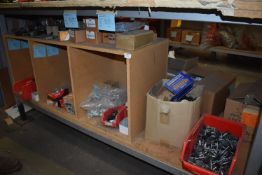 *Contents of the Lower Shelf on Workbench to Include Plastic End Caps, Adjustable Feet, Wood Screws,
