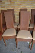 Four Rattan Chairs with Leatherette Seats