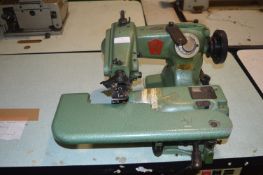 Bottom Fella Bind Hem Stich Machine Co. Sewing Machine on Table