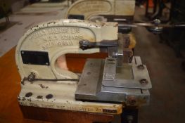 Two Thomas Walker Trouser Fastening Machine on Table