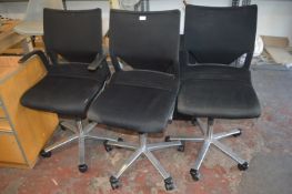 Three Black Swivel Chairs