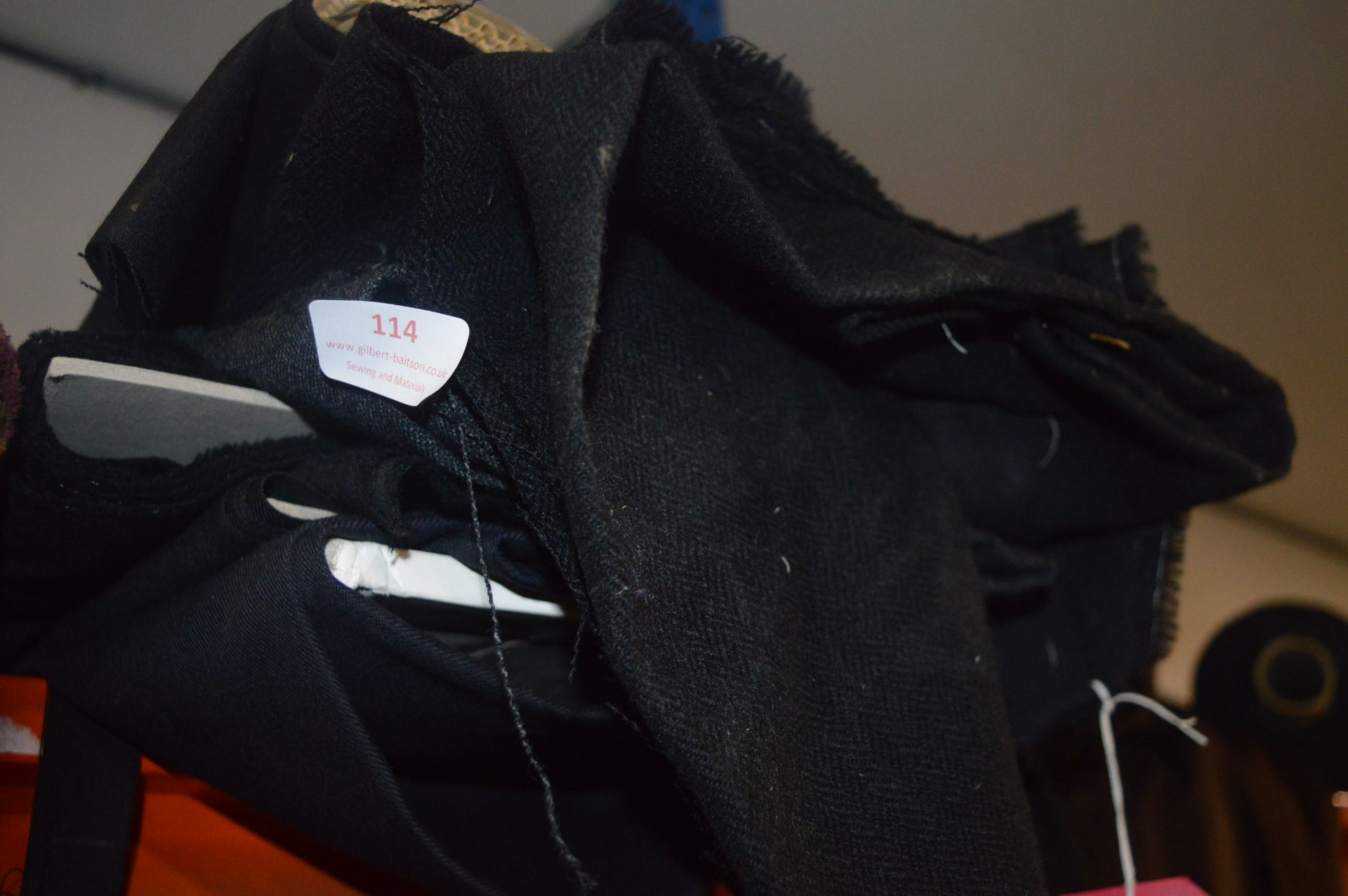 Quantity of Assorted Black Cloth, Woven Cotton, and Felt Materials